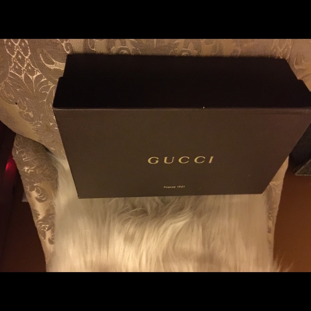 A pair of Gucci Shoes